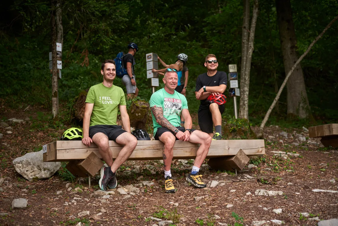 Detail from the Witch cycling trail - cyclists in good spirits rest on one of the benches on the Coprnica cycling trail, which leads along Lake Cerknica and across the Slivnica mountain.