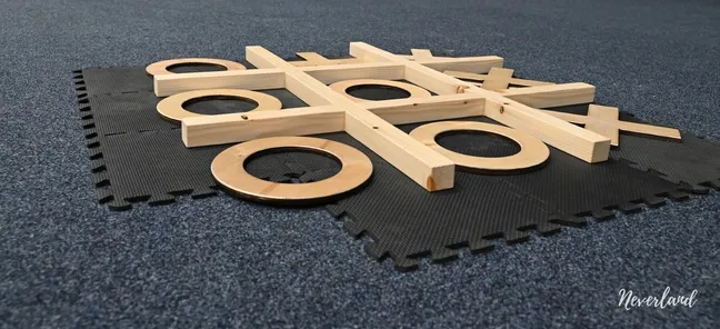 A giant wooden tic-tac-toe game set up for visitors at the event.