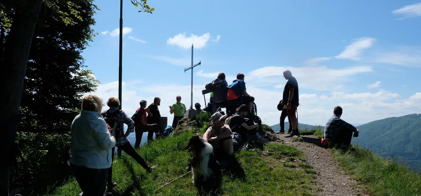 Hikers resting at a scenic summit.
