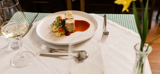 Meat main course with barley risotto, vegetables and sauce at Notranjska house.