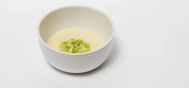 Garlic soup with parsley foam, microgreens and buckwheat crisps.
