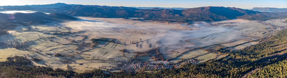 The view on Javorniki hills from mount Slivnica with Cerknica plain in the middle.